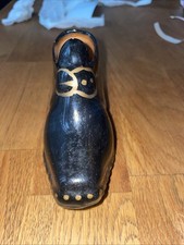 Black pottery shoe: witchy kitsch ceramic black painted boot ornament, 1960s