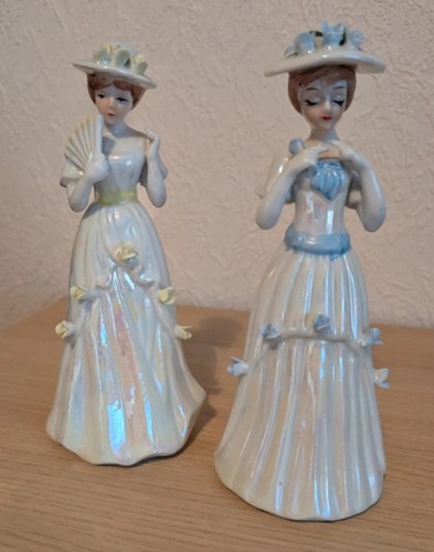 Pair lady figurines one - lady,