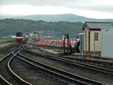 PHOTO  OPERATING THE GROUND FRAME PORTHMADOG HARBOUR STATION THIS WAS DURING SHU