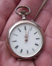 AN ANTIQUE SILVER & GOLD PLATED LADIES CONTINENTAL POCKET, FOB WATCH, TICKING.
