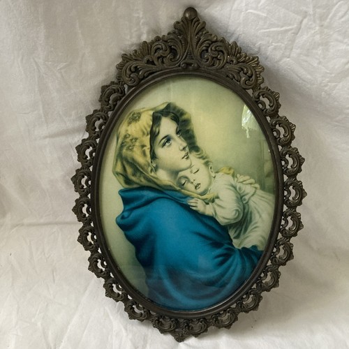 Oval cast metal madonna and - oval,
