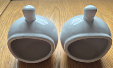 Two White Salt Pigs –