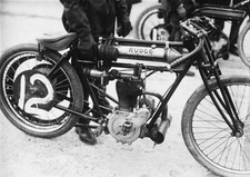 Motorcyclist holds Rudge