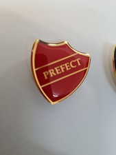 4 x RED ENAMEL  PREFECT BADGES