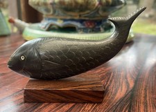 Small Carved Stone Fish on a wooden base  