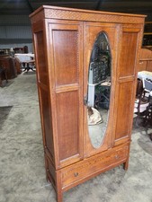 20thC oak single mirrored door wardrobe drawer panelled