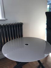 Glass look tabletop with central hole cut for portable ease & multiple locations