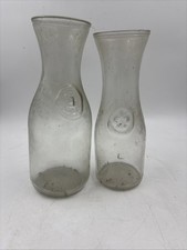 2 Vintage Embossed  "Since 1852" Glass Bottle