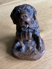 Vintage figurine of a St. Bernard dog with a barrel collectable dog ornament