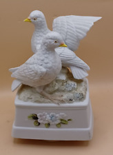Musical ceramic ornament of a pair of doves music box movement