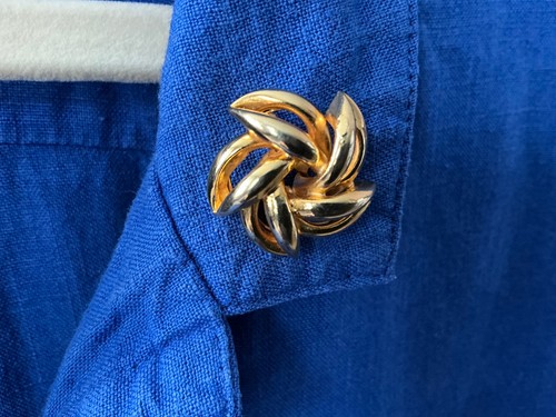 Brooch with pin fastened - with,