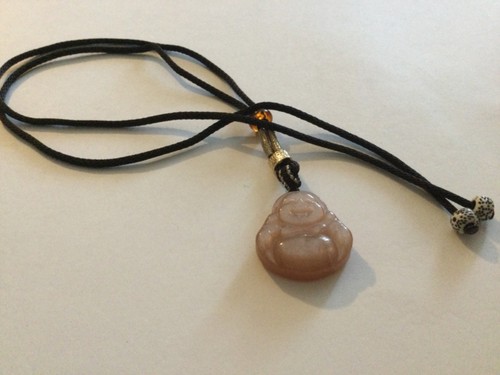 Carved pink stone - stone, laughing