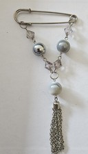 Safety pin Style Brooch Silvertone With Dangling Decorated Design