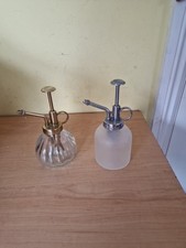2 Glass Spray Bottles  1 Silver Top, 1 Gold Top