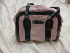 Pink Antler Overnight Bag With Black Handles And Trim.