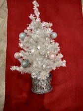 white glittery Christmas tree with blue and pink decorations