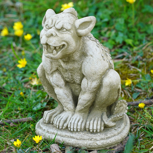 Grinning gargoyle stone statue - grinning,