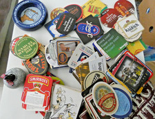 Vintage bar items - many old beer mats, 1 ashtray, curling stone, bar towel