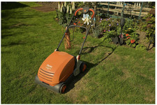 Orange Flymo Lawnrake compact