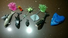 9 rubber sea creatures and 3 pieces of plastic coral