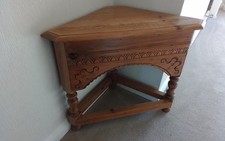 small wooden corner table carved pattern on 3 sides