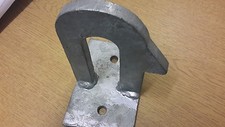 Staple catch on plate spring