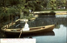 Edwardian woman rowing a boat