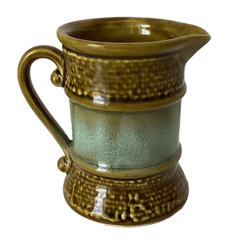 1970s green milk jug with - milk,