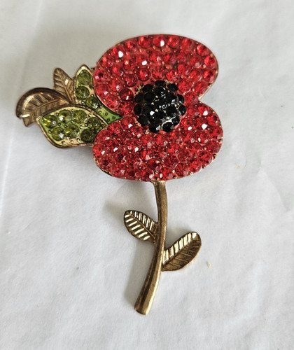 Gold tone metal flower - tone, brooch