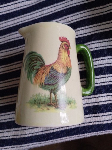 Heron cross pottery jug - cross,