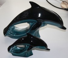 Pair Of Poole Pottery Dolphins in blue and black glaze.