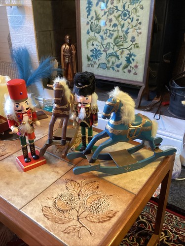 Two wooden rocking horses and - two,