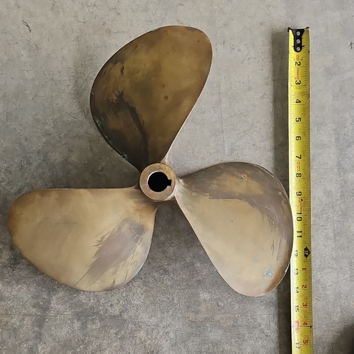 Antique brass boat motor