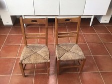 A Pair Of Mid Century Children’s Wooden Chairs With Straw Seats