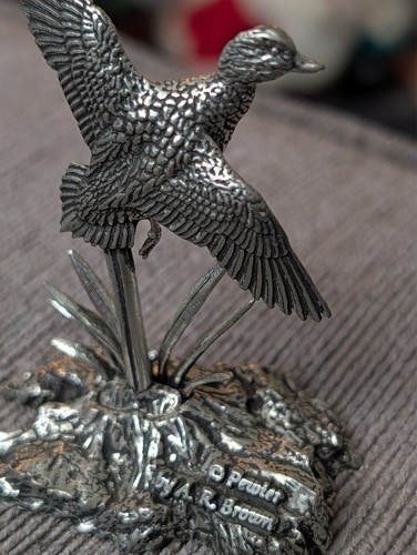Pewter mallard flight by - in,
