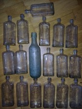 18 small vintage medicine glass bottles