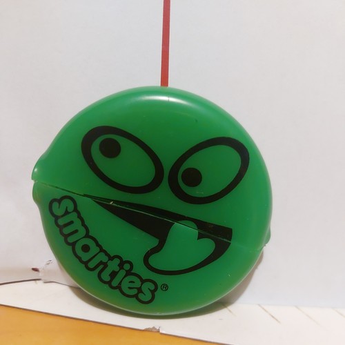 Smarties green plastic smiley - smarties,