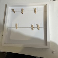 white hanging photo frames