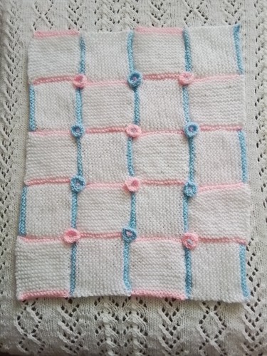 Hand knitted baby - hand,