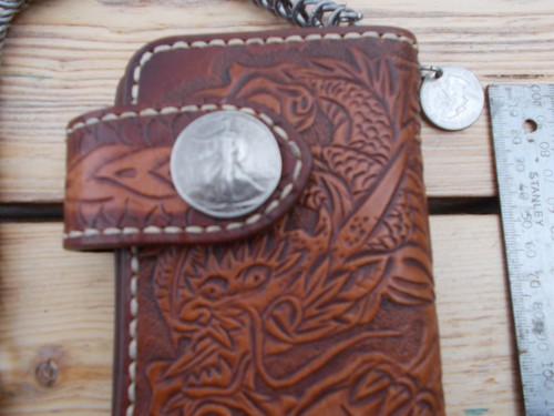 Tan carved leather wallet and - carved,