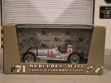 Mercedes W125  1/43 scale model car by Brumm Gold in display case. Just awesome