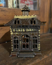 ANTIQUE cast iron coin bank