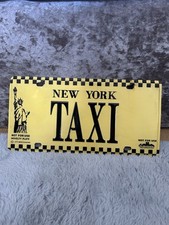 novelty license plate replica of a New York City taxi plate.