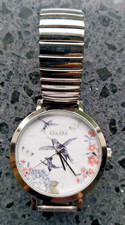OASIS “WORTH EVER MINUTE” LADIES WATCH – HUMMING BIRD & FLOWER FACE – GOOD CONDI