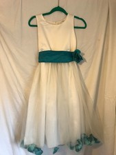 Beautiful white bridesmaid/flower girl dress age 10-12. Flower petals in hem. 