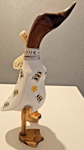 Wooden duck with bee decor