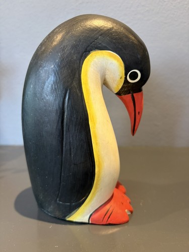 Hand carved solid wood penguin - hand,