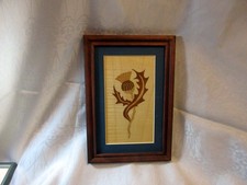 A VINTAGE SCOTTISH FRAMED MARQUETRY PICTURE OF A THISTLE
