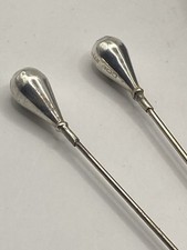 PAIR OF TEAR DROP ANTIQUE SILVER HAT PINS. (B39)