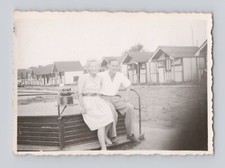 Old B&W Photo Man Woman on old Wooden Roundabout Playground  Chalets Holiday